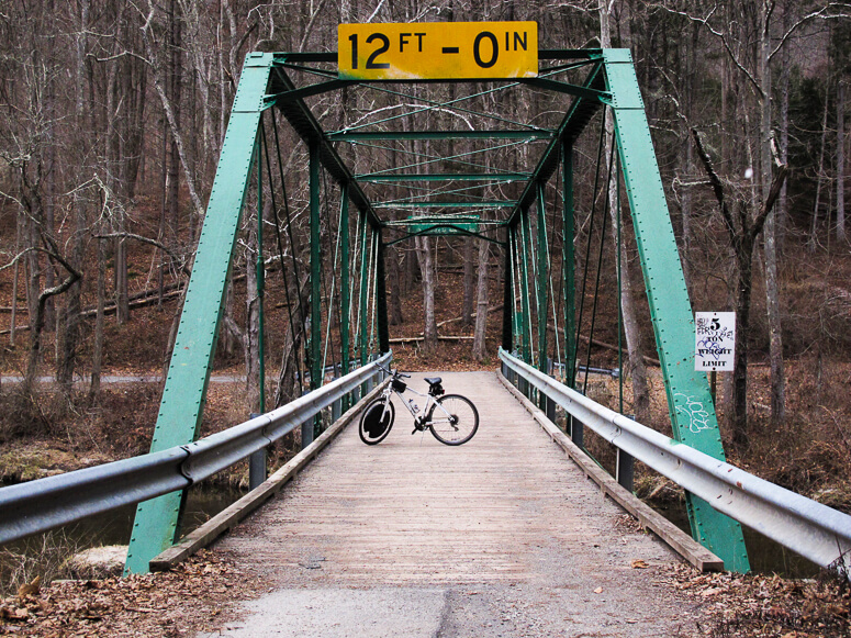 a bicycle on an iron bridge