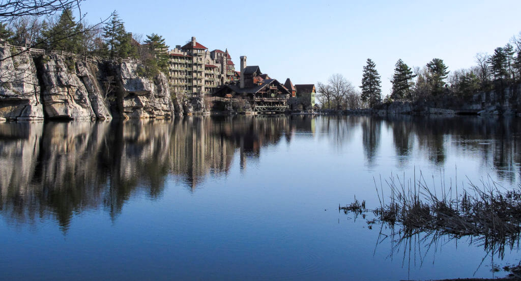 A glassy blue lake with Mohonk Preserve in New Paltz, New York.